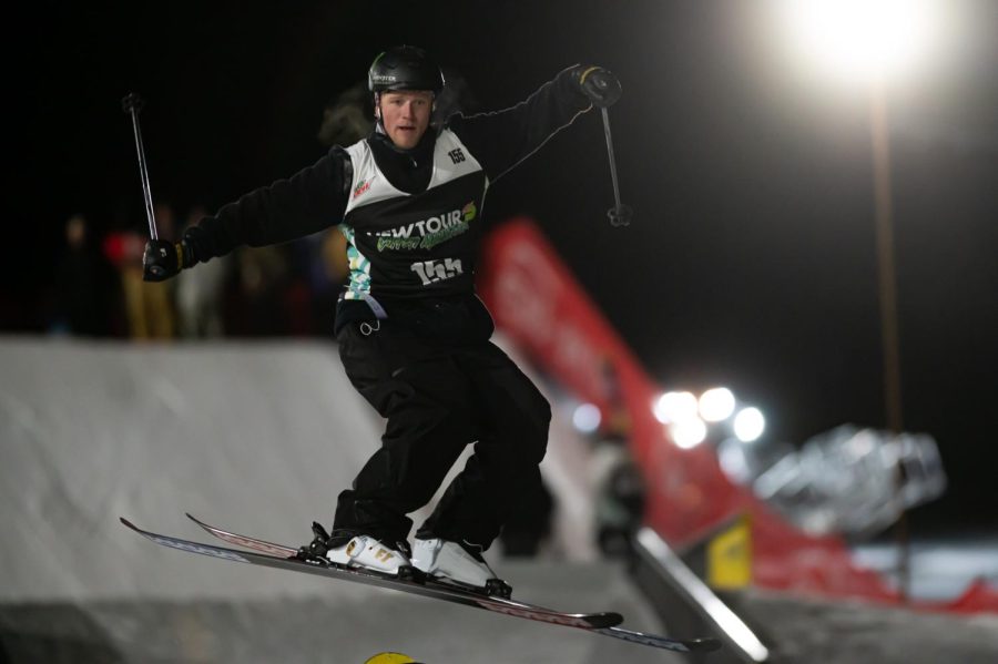 Colby Stevenson in the air before one of the rails during men’s ski street style finals at Dew Tour