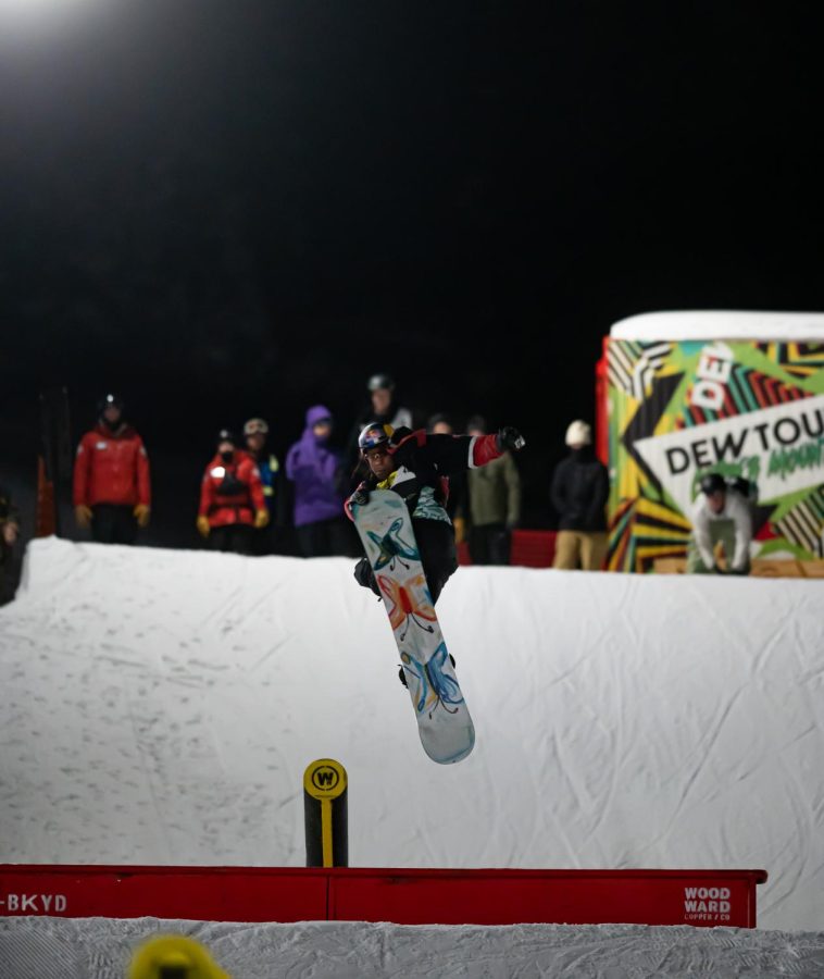 Zeb Powell performs a nose grab mid spin during men’s snowboard street style finals at Dew Tour Dec. 18.