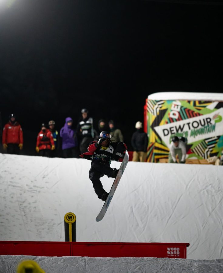 Zeb Powell performs a nose grab mid spin during men’s snowboard street style finals at Dew Tour Dec. 18