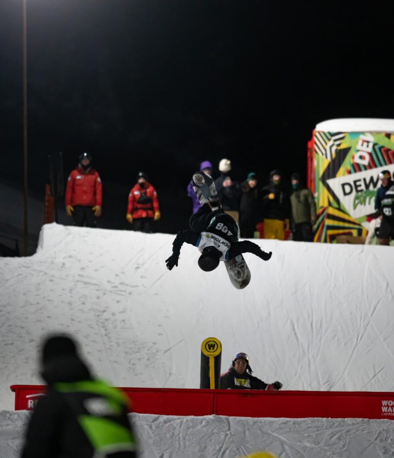Miles Fallon and Zeb Powell flip together off a rail in men’s snowboard street style finals at Dew Tour Dec. 18.