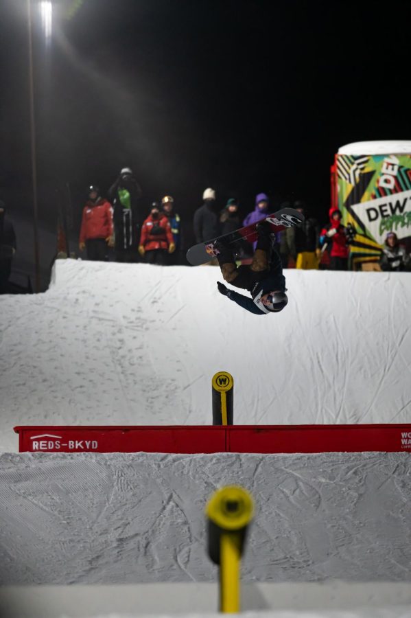 Sebastien Toutant flips off a rail in men’s snowboard street style finals at Dew Tour Dec. 18. Toutant placed 2nd in the event and won best trick with a Frontside boardslide to 360 switch up over the gap to frontside boardslide to fakie.