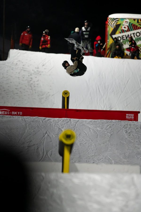 Jesse Paul flips off a rail in men’s snowboard street style finals at Dew Tour Dec. 18.