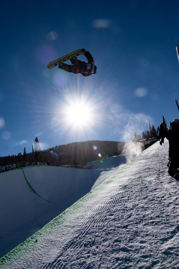 Ayumu Hirano grabs the tail of his board mid spin during the men's superpipe finals at Dew Tour