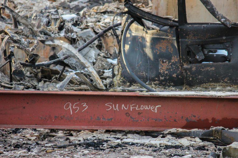 The address of a house is written on a fallen beam.