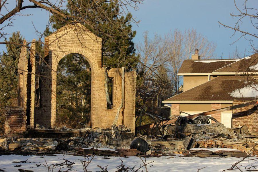 The rubble of what once was home can be seen right next to a house that was untouched by the flames.