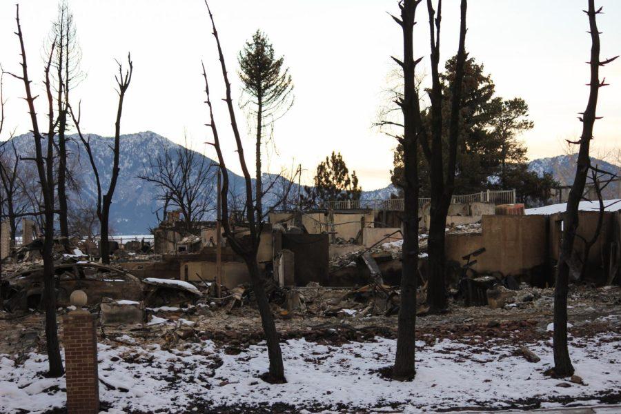 Only the stone wall remains of house burned by the Marshal fire.