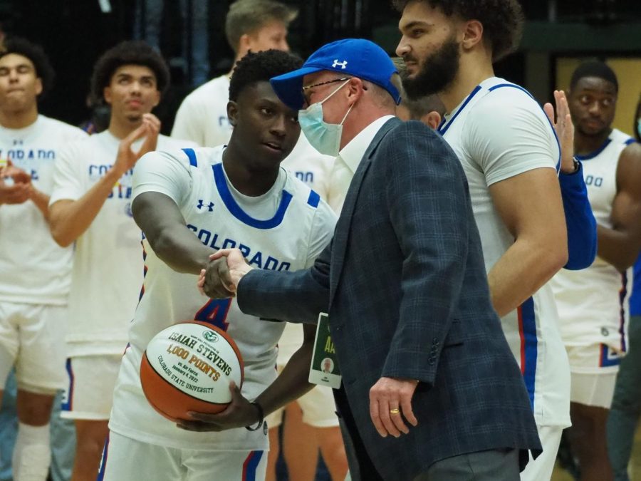 Colorado State athletic director Joe Parker shakes hands with Colorado State guard Isaiah Stevens before the men’s basketball game against the University of New Mexico Jan. 19. Stevens and David Roddy were recognized for reaching 1,000 career points each. 