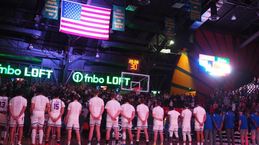 Members of the Colorado State men’s basketball team stand for the presentation of the United State flag and the playing of the national anthem prior to their game against the University of New Mexico Jan. 19