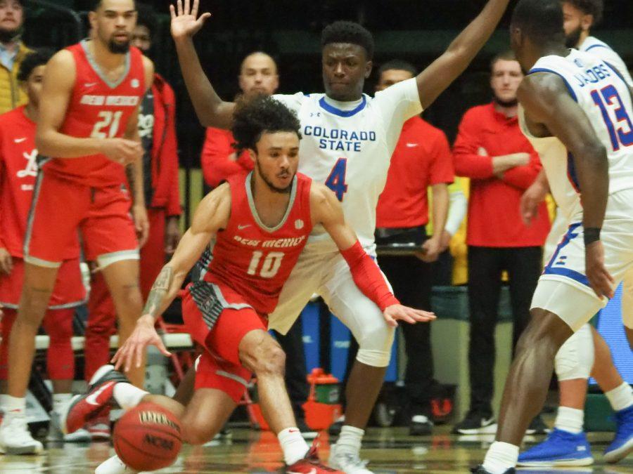 Colorado state guard Isaiah Stevens (4) runs with University of New Mexico guard Jalen House (10) at Moby Arena Jan. 19. The Rams beat the Lobos 80-74