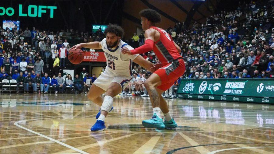 Colorado State forward David Roddy (21) dribbles past New Mexico guard Jovonte Johnson (13) Jan. 19.