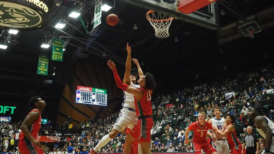 Colorado state guard Isaiah Rivera (23) gets fouled by University of New Mexico guard Javonte Johnson (13) at Moby Arena Jan 19.