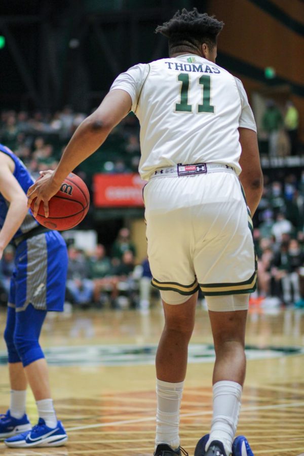 Dischon Thomas (11), forward, keeps the ball away from the Air Force Academy.