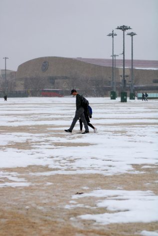 Two students trek across the IM fields on their way home