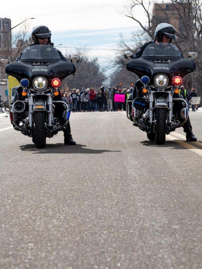 Officer Matt Brede and officer Shane Hasebroock provide escort for the Martin Luther King day march down Howes Street in Fort Collins Colorado Jan.17.