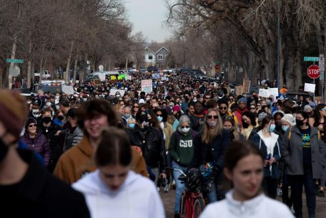 Participants in the Martin Luther King Jr. Day celebration march down Howes Street in Fort Collins, Colorado, Jan. 17.
