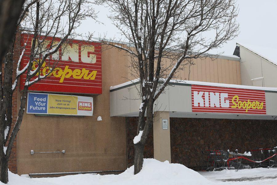 the storefront of a king soopers surrounded by snowy trees