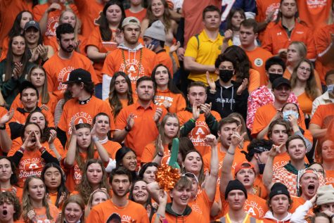 Students clap and cheer during a Colorado State basketball game.