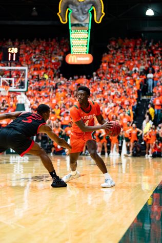 Isaiah Stevens (4) keeps the ball away from a defender during the Colorado State basketball game vs San Diego State University