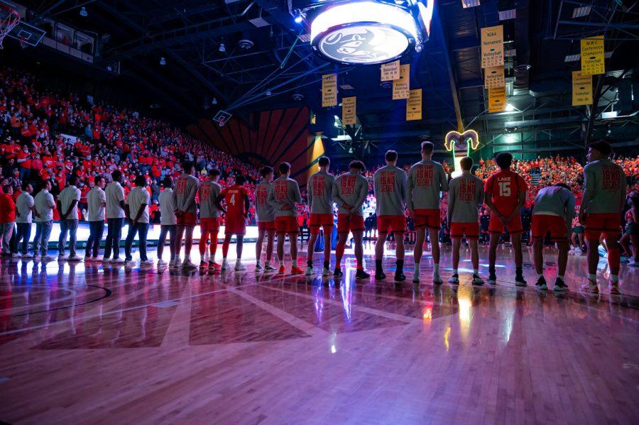 Colorado State University Basketball team members stand while the National Anthem is played in Moby Arena