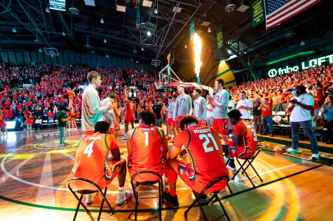 Isaiah Stevens (4), John Tonje (1) and David Roddy (21) sit waiting to be called into the opening of the Colorado State basketball game vs San Diego State University