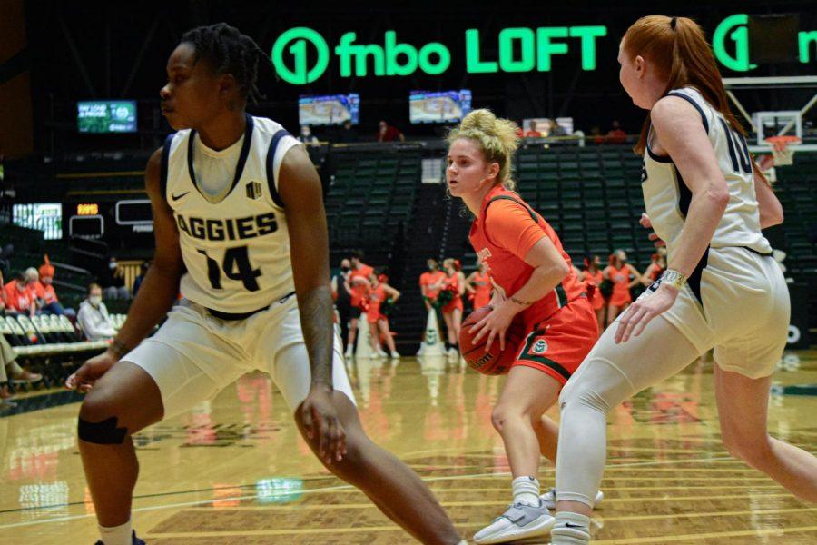 Mckenna Hofschild (4) playing an aggressive offense with the ball during a game against the Utah State Aggies.