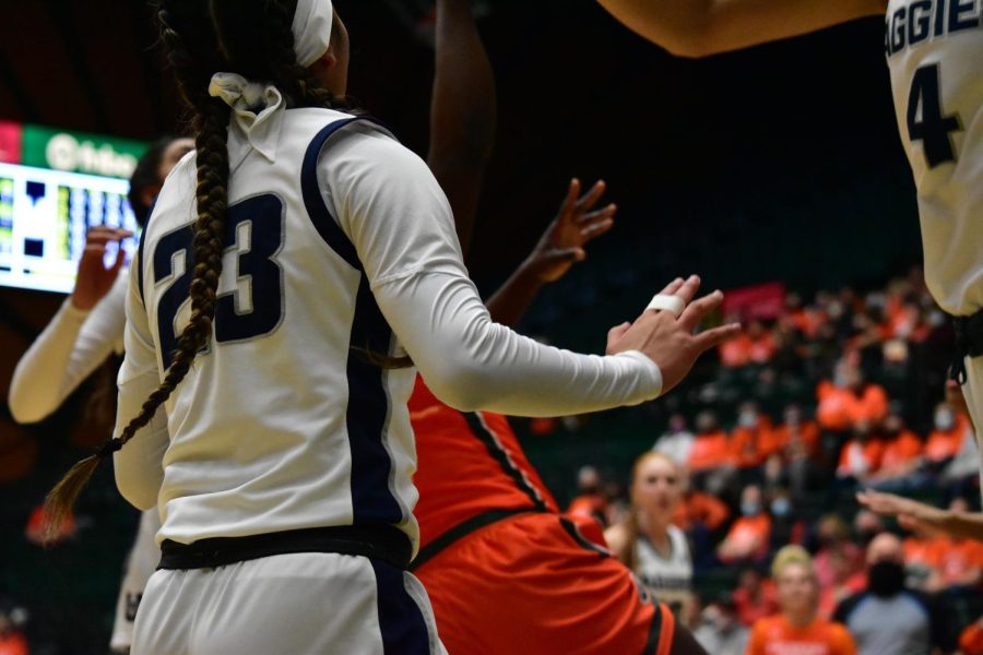 Colorado State Rams womens basketball team playing a heated game against the Utah State Aggies.