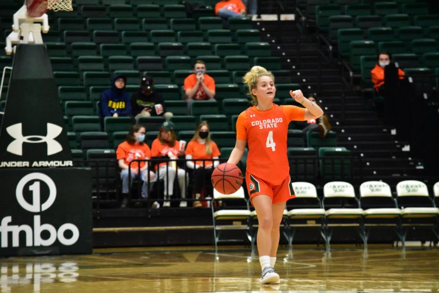 Mckenna Hofschild (4) dribbling the ball to establish a play during a game against the Utah State Aggies.