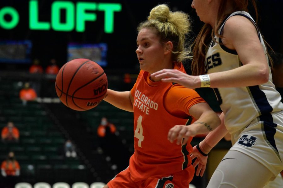 Mckenna+Hofschild+%284%29+Colorado+State+Rams+womens+basketball+guard+on+offense+with+the+ball+during+a+game+against+the+Utah+State+Aggies.