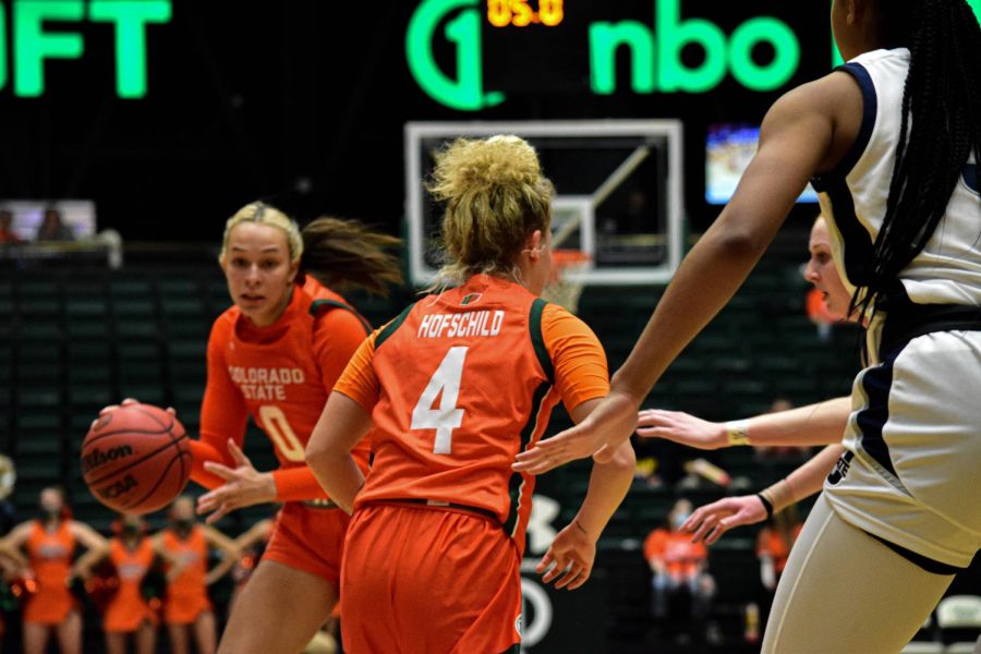 Kendyll knizer (0) and Mckenna Hofschild (4) on offense during a heated game against the Utah State Aggies.
