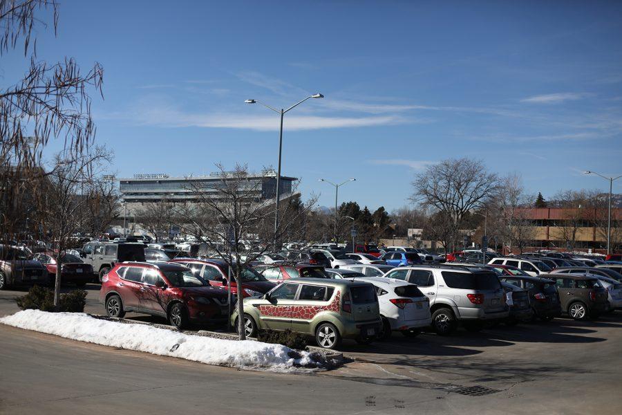 Cars fill a parking lot on a sunny day