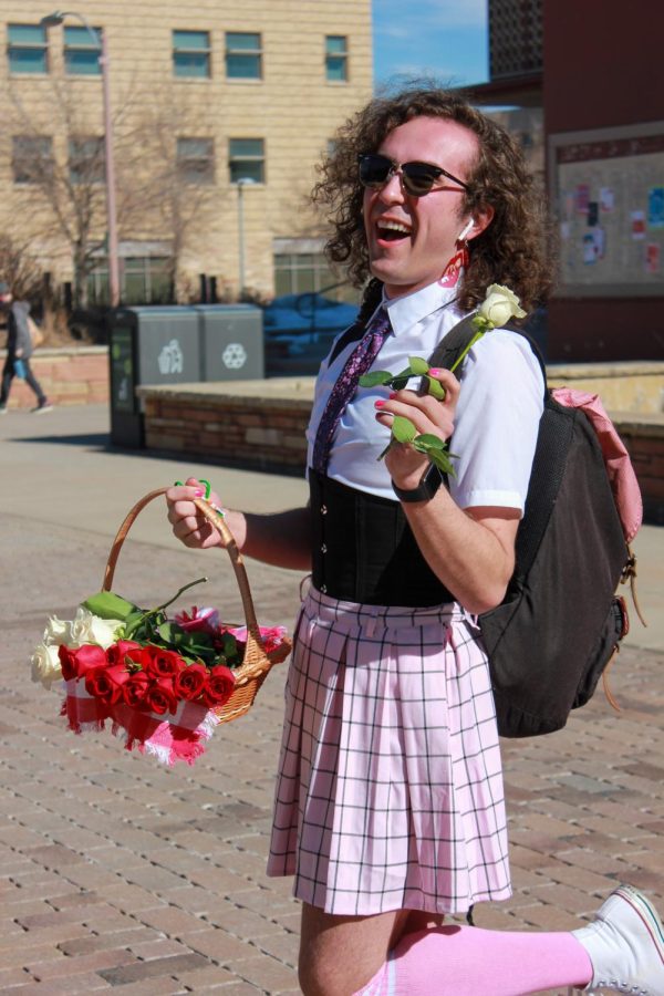 Andrew Spencer walked around campus giving out flowers and chocolate to students