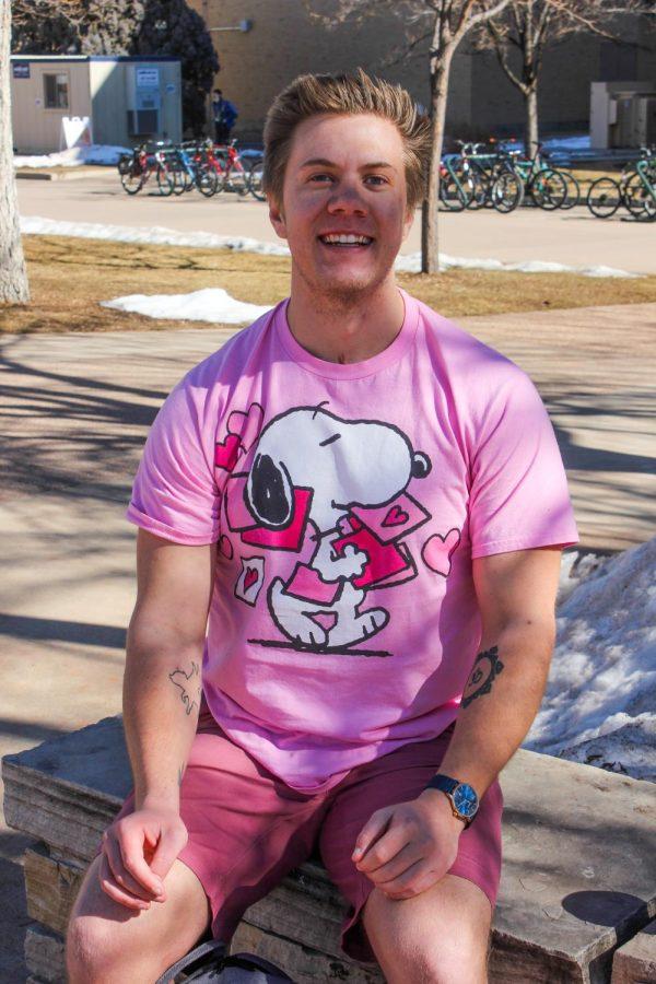 Nash wears a Snoopy Valentines Day shirt along with pink shorts.
