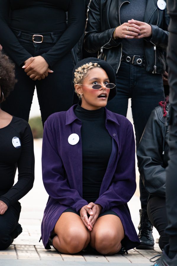 Breonna Abuya sits in the oval during the Black Panther Black Out event