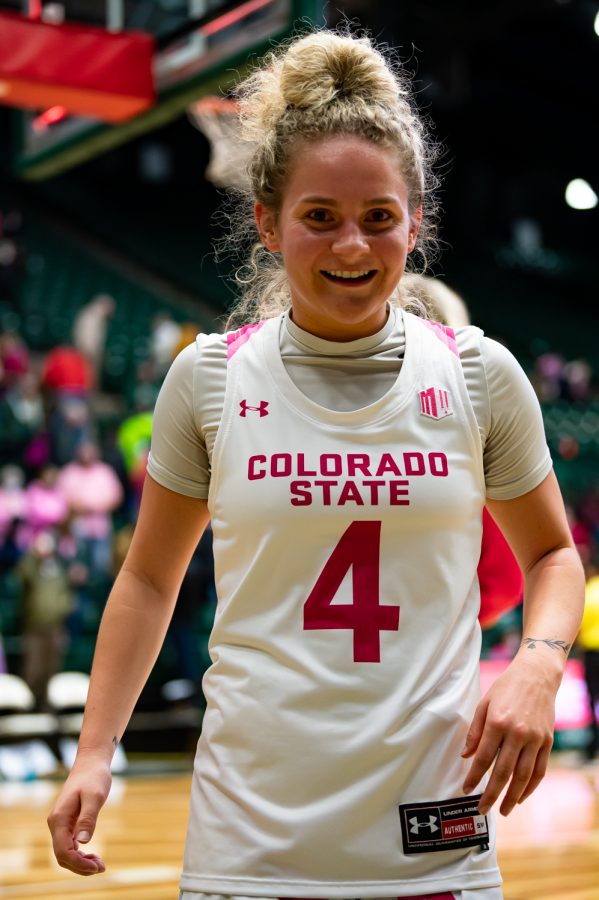 McKenna Hofschild (4) celebrates after the Colorado State basketball game vs University of Wyoming