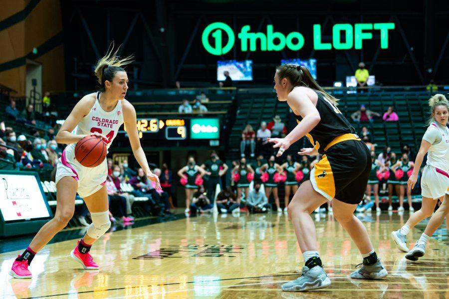 Sydney Mech (24) drives to the basket during the Colorado State basketball game vs University of Wyoming