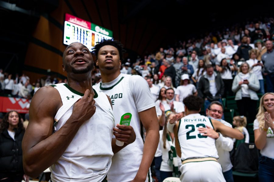 Chandler Jacobs (13) and Dichon Jacobs (11) celebrate together after the CSU basketball game vs University of Wyoming at Moby Arena