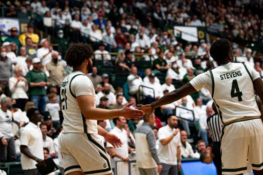 David Roddy (21) and Isaiah Stevens (4) high five during the Colorado State basketball game versus the University of Wyoming at Moby Arena Feb. 23. CSU won 61-55.
