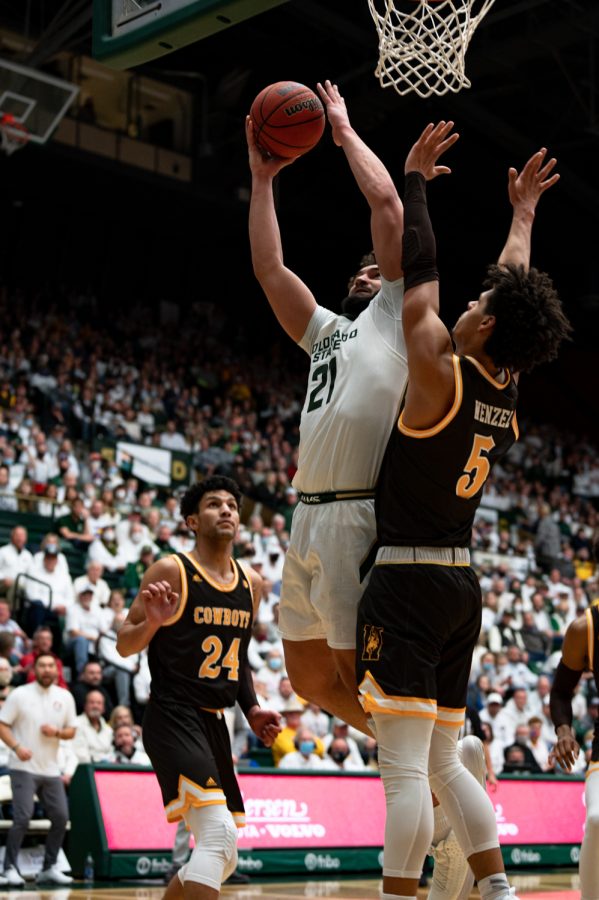 David Roddy (21) drives to the basket during the CSU basketball game vs University of Wyoming at Moby Arena