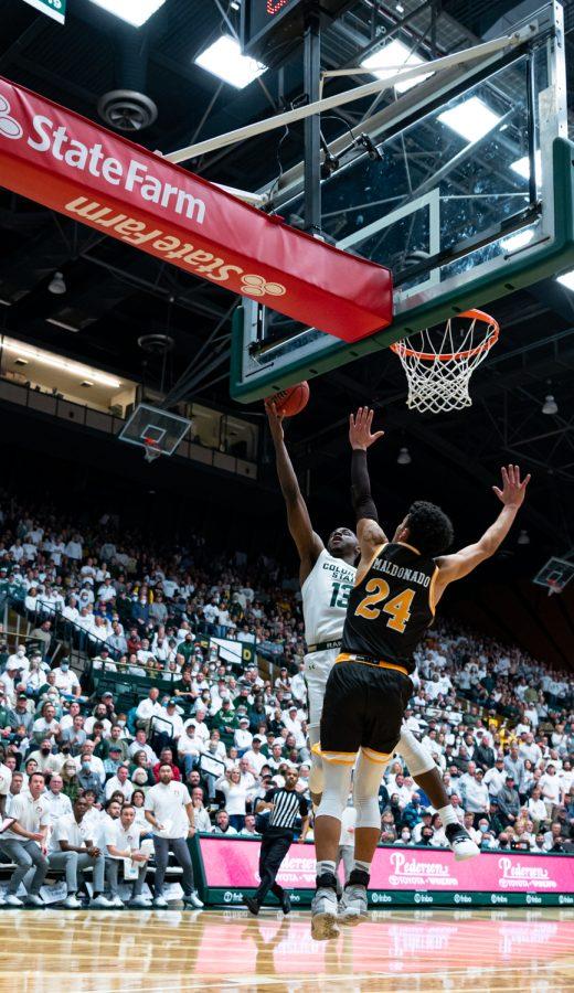 Chandler Jacobs (13) goes for a layup during the CSU basketball game vs University of Wyoming at Moby Arena