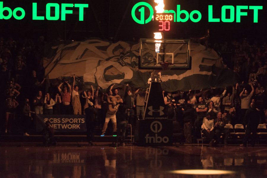 Members of the Colorado State University student section fly a banner that reads "Proud to Be" before the start of the men's basketball game against California State University, Fresno Feb. 11, 2022.