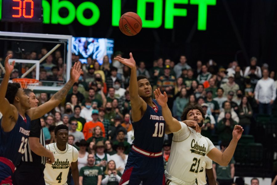 California State forward Orlando Robinson (10) tips the ball to his teammate, guard Deon Stroud (13). during their road matchup against the Colorado State Rams Feb. 11, 2022.