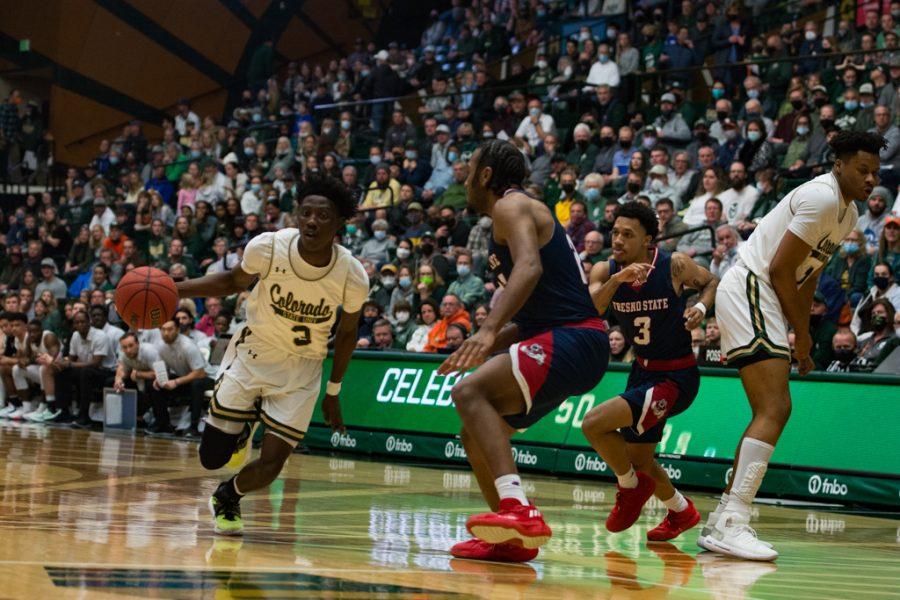 Colorado State guard Kendle Moore (3) dribbles the ball towards the rim against California State University, Fresno Feb. 11, 2022.