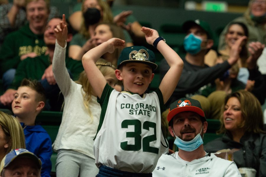 A young Colorado State fan pumps up the crowd at the Colorado State men's basketball game Feb. 11, 2022.