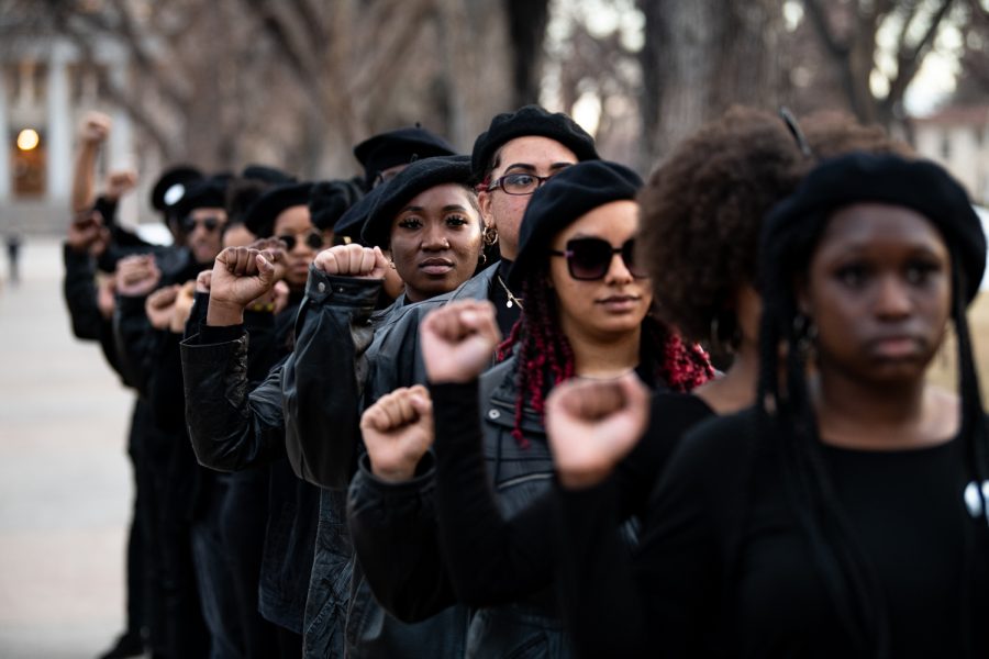 Bolu Folarin, during a Black Out event, honors the Black Panther Party Feb. 15