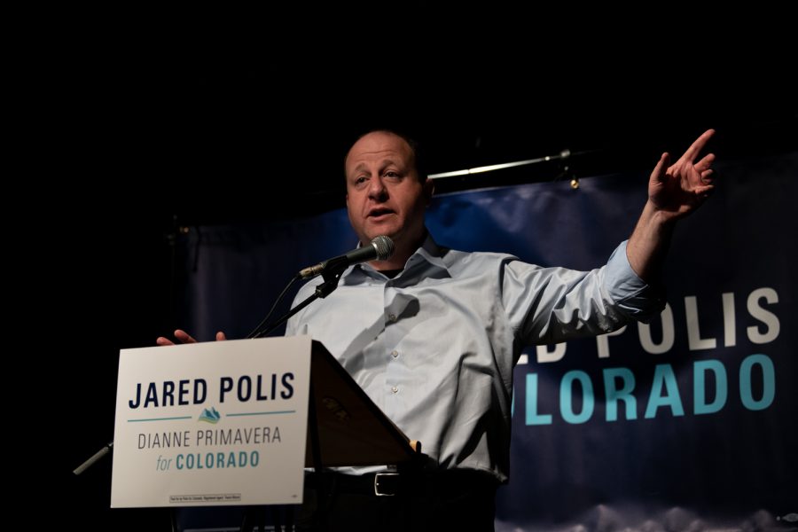 Gov. Jared Polis speaks in front of Fort Collins residents at Avogadros Number, located at 605 S. Mason St. about his re-election campaign Feb. 18.