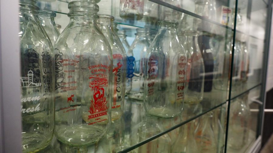Milk bottles sit in a display case Feb. 4, 2022