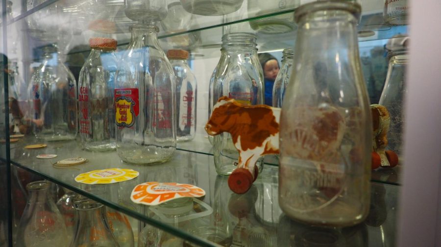 Milk bottles sit in a display case Feb. 4, 2022