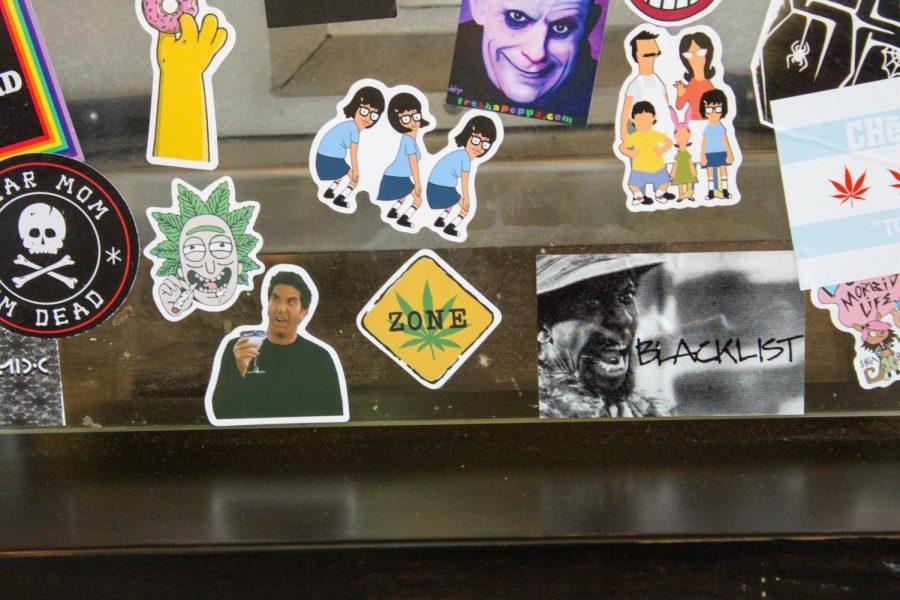 Weed themed stickers plaster the glass barrier that separates the customers from the kitchen.