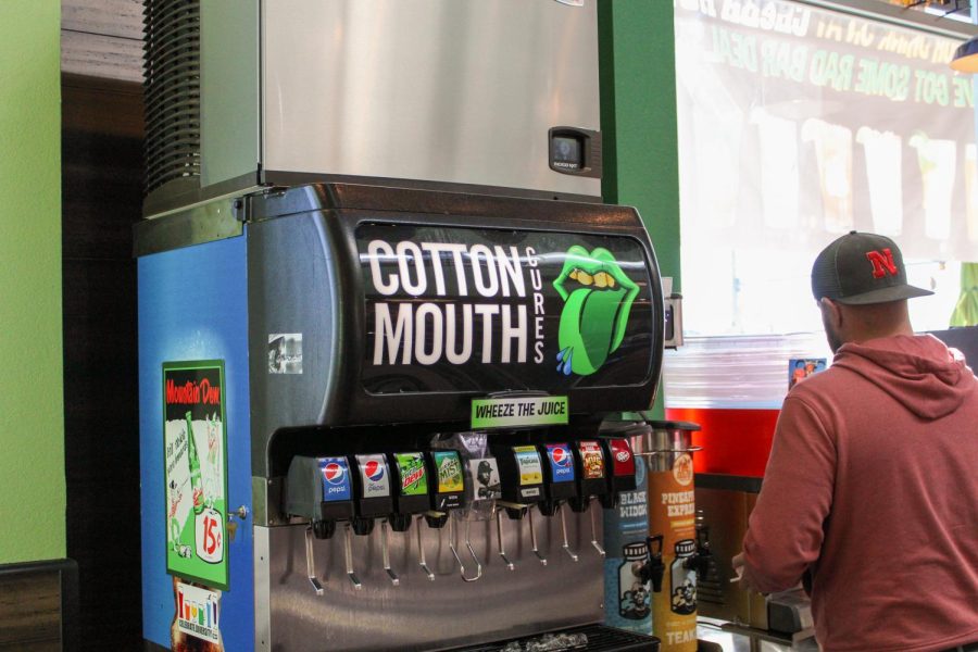 A soda machine called the Cotton Mouth Cures sits inside of Cheba Hut.