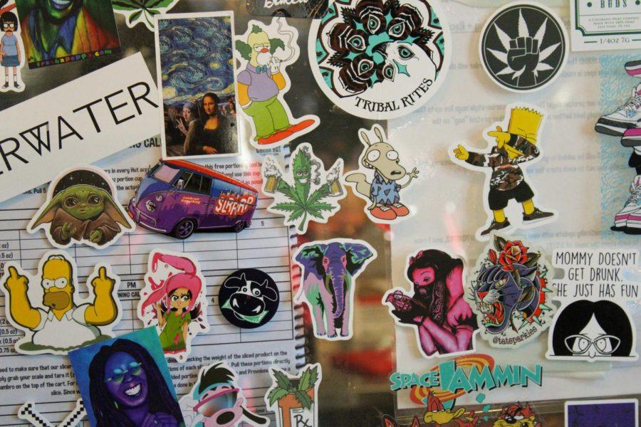 Weed themed stickers plaster the glass barrier that separates customers from the kitchen.